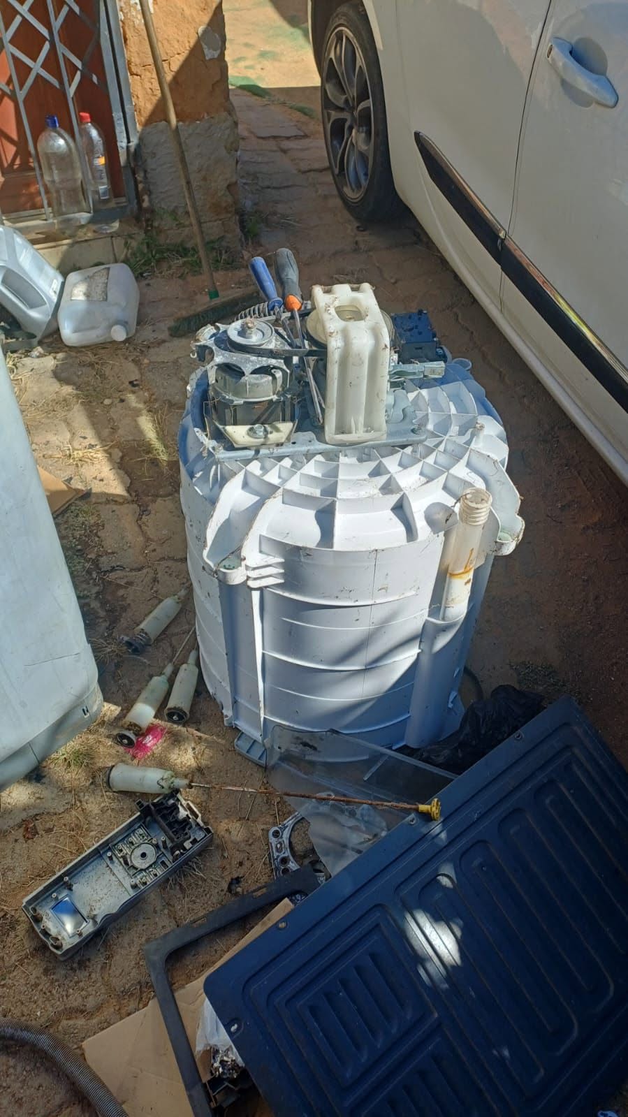 Washing machine motor being repaired